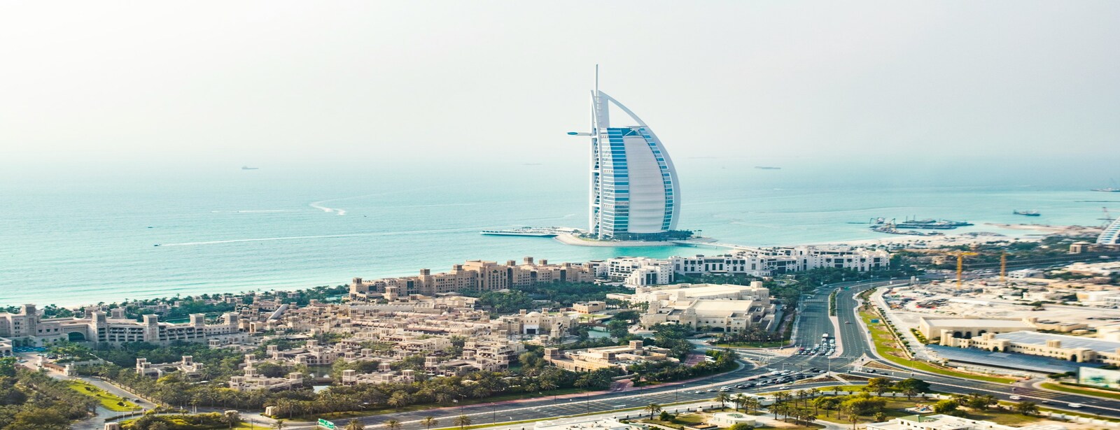 A man using a mobile phone and smiling